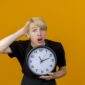 Man holding a clock
