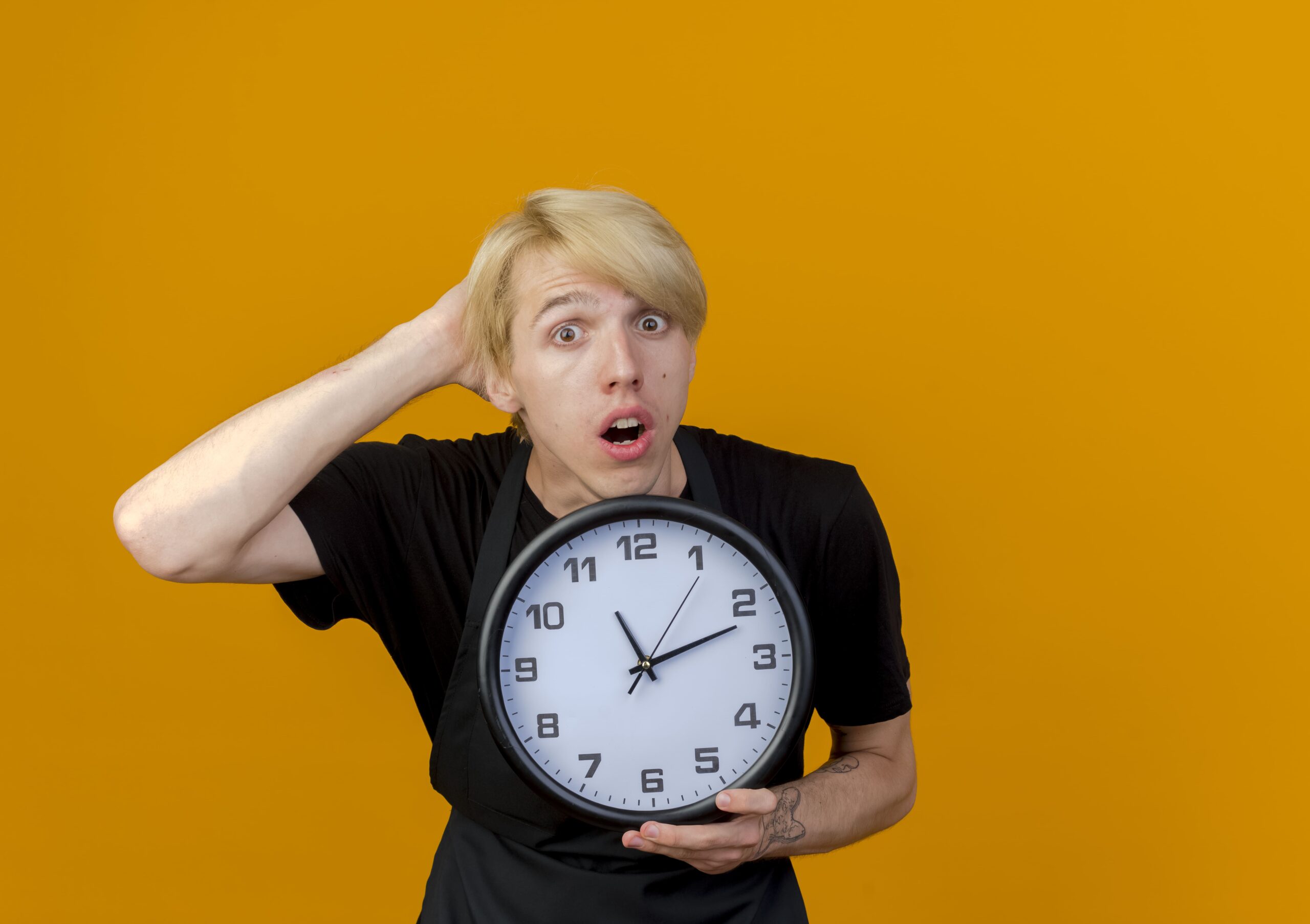 Man holding a clock